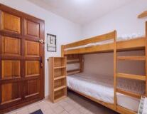 a bedroom with a wooden door